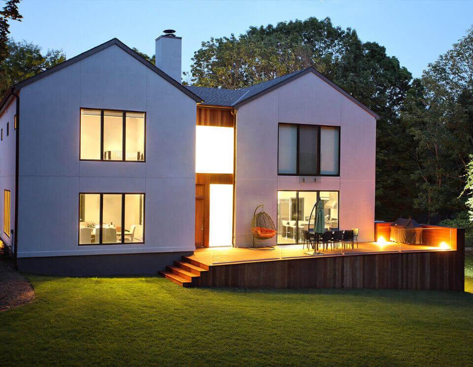 View of the back patio and from the lawn in the evening